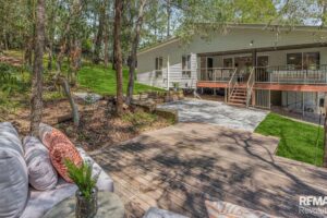 11 encumbrances. Battle-axe block. Protected trees everywhere. Sold in 22 days.