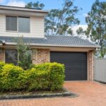 Petrie duplex hits street record despite neighbour's Michael Myers open home threats