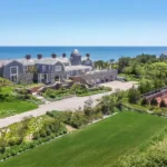 Calvin Klein's former East Hampton estate relists for A$231 million, a price that would set a new Hamptons sales record.