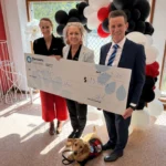 Harcourts Foundation $13,000 donation to Smart Pups. Photo supplied (AI Expanded)