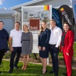 (L-R) Kathleen Hope - CEO, SunnyKids , Lorenzo and Amanda - happy buyers, Sarah Cain and Michael Cain - Devcon Property Group; Jodi Price, Principal, LJ Hooker Mooloolaba | Mountain Creek. Image Supplied
