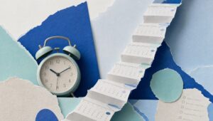 Hand-cut paper collage of a vintage alarm clock beside a staircase folded from torn calendar pages, in blues and mint