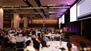 Hamish Wilson addressing the audience at PM/ONE 2026