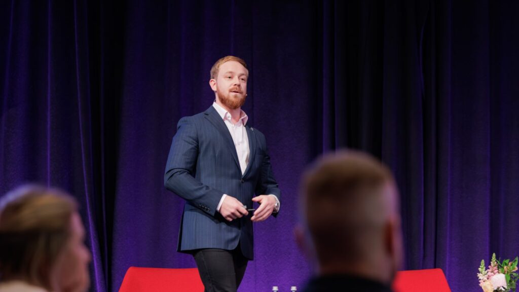 Naaman Fraser speaking at PM/ONE 2026