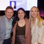 Andrew Palmer and Katie Tilden with panel host Sam Macri at PM/ONE 2026