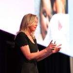 Chelsea Pottenger speaking at PM/ONE 2026