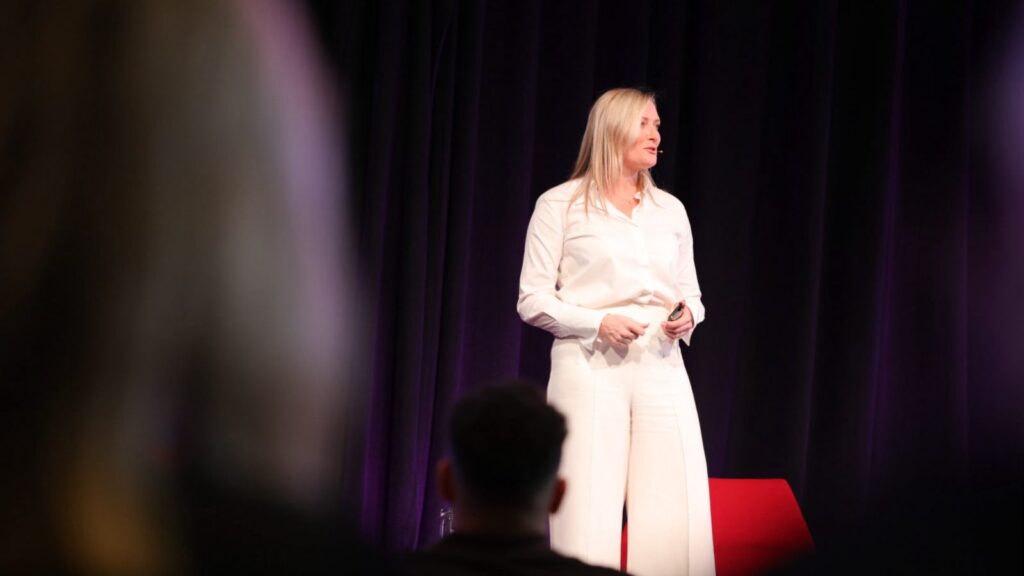 Pamela Medeiros speaking at PM/ONE 2026