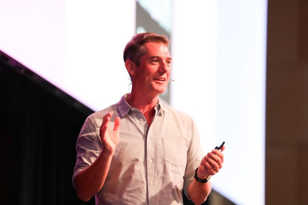 Tim Duggan speaking at PM/ONE 2026