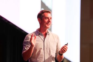 Tim Duggan speaking at PM/ONE 2026