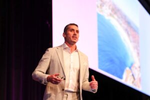 Quinn Darragh speaking at PM/ONE 2026