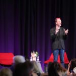 Dom Thurbon speaking at PM/ONE 2026