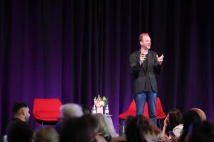 Dom Thurbon speaking at PM/ONE 2026