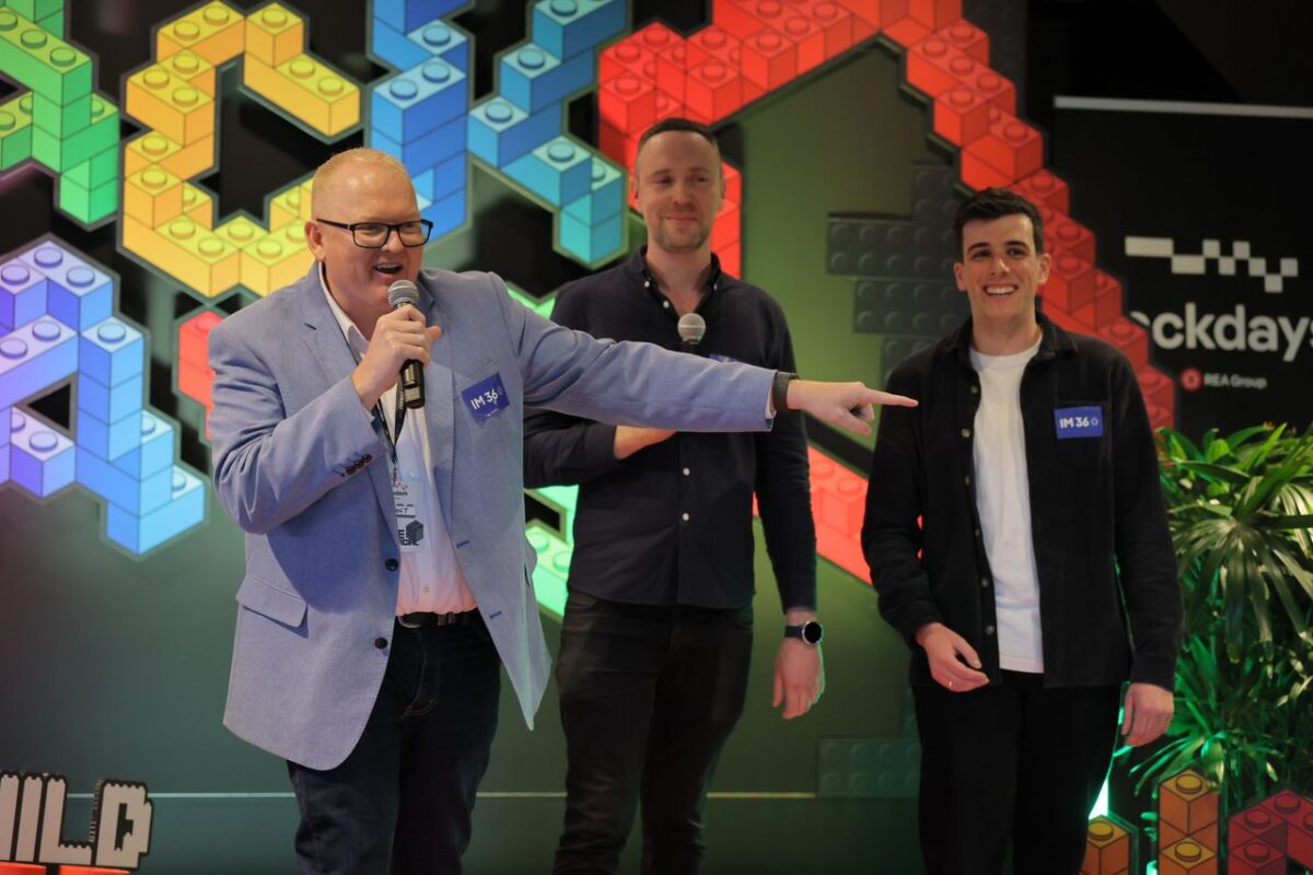 The IM360 team presenting Ray White Commercial CSR’s customer project at REA Hackdays 2026